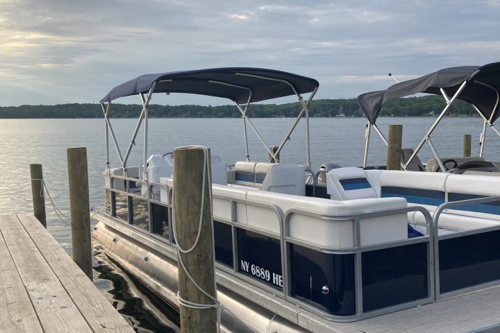a boat is docked next to a body of water