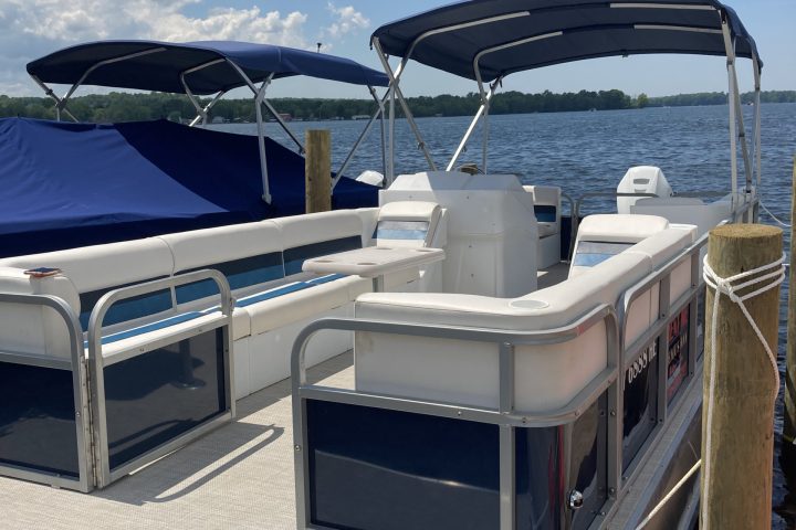 a boat sitting on top of a car